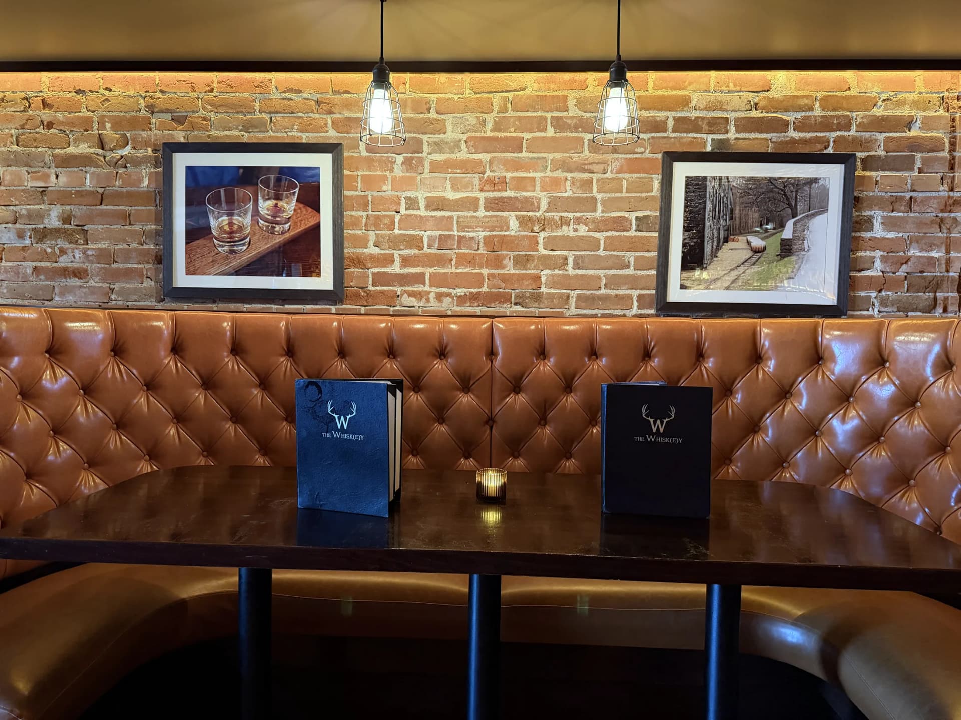 Leather booths under pendant lights